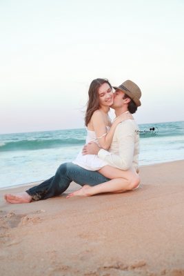 Love story, engagement photography and proposal portraits in a beach or a park environment.
