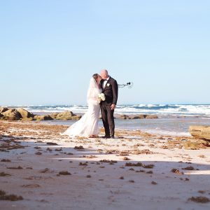 Professional wedding photography in Palm Coast featuring a joyful bride and groom on their wedding day.
