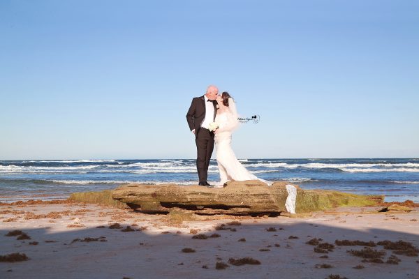 Professional wedding photography in Palm Coast featuring a joyful bride and groom on their wedding day.