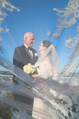Professional wedding photography in Palm Coast featuring a joyful bride and groom on their wedding day.